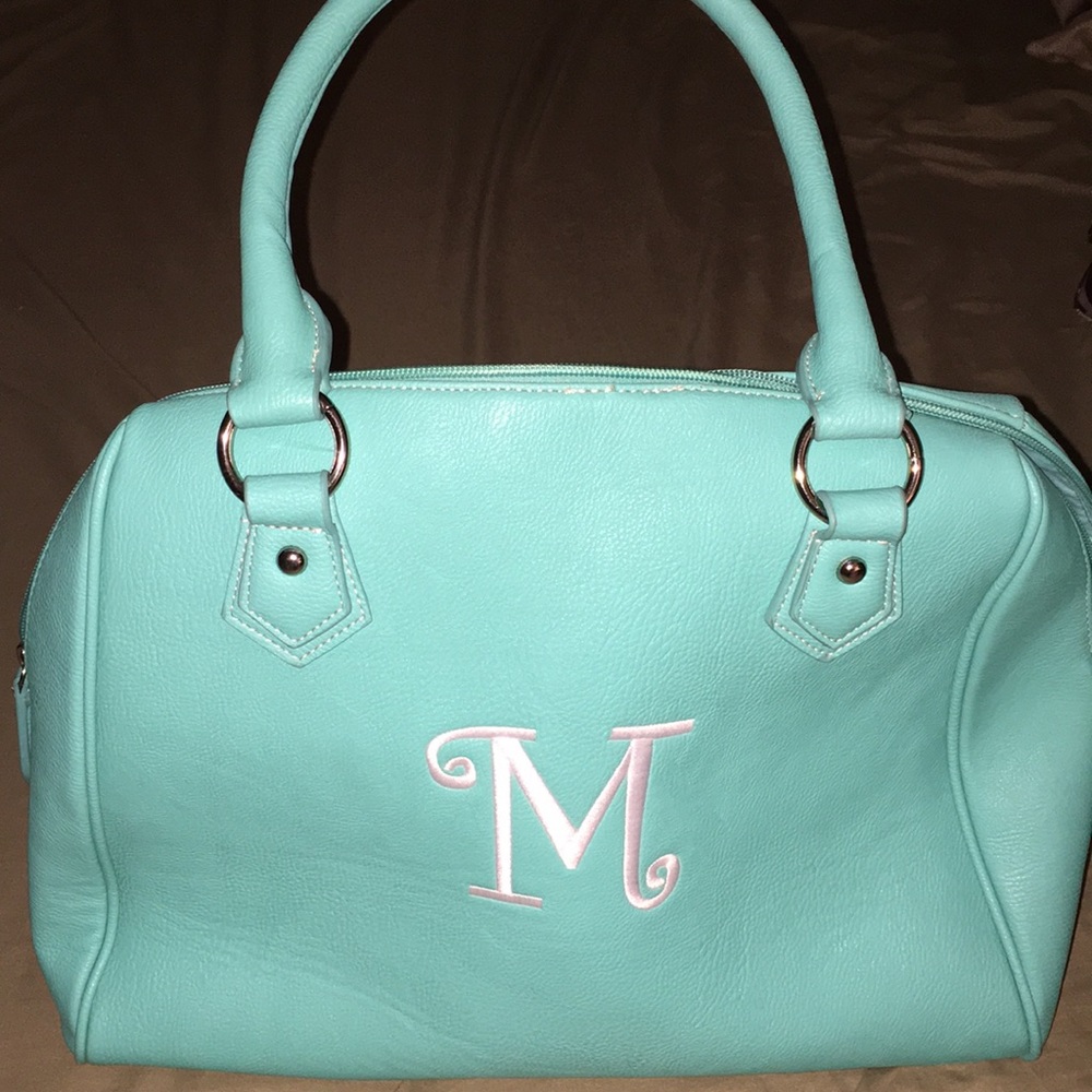 Large teal handbag. New, never carried.